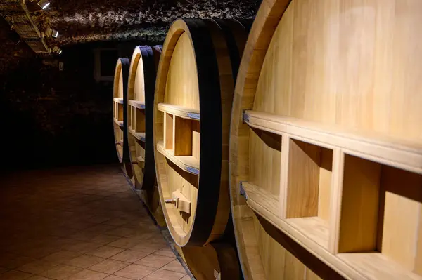 depositphotos_684584246-stock-photo-underground-wine-cellars-barrels-aging