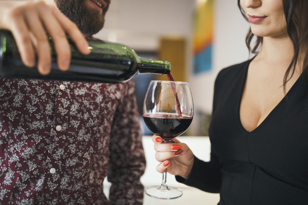 man-serving-wine-woman-having-date-1024x683.jpg