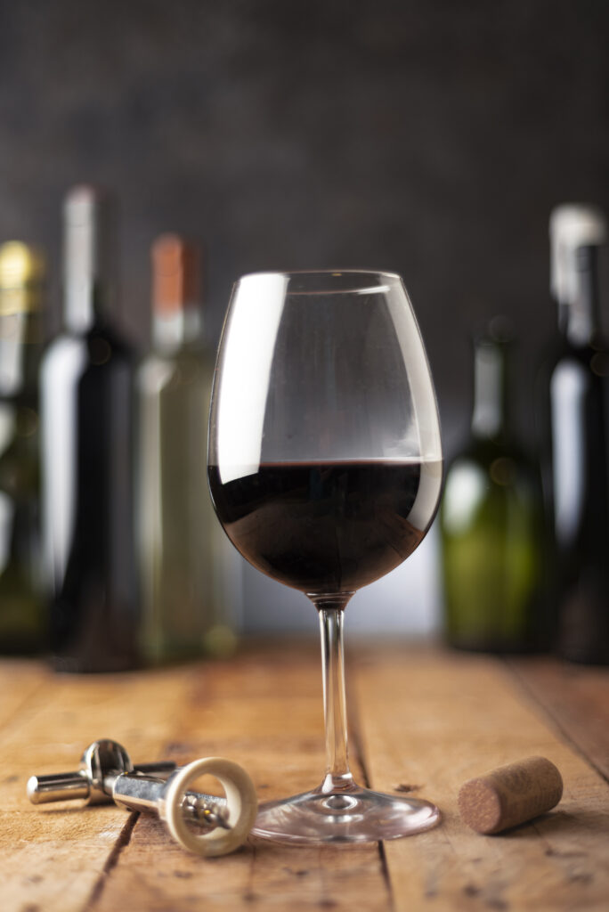 red-glass-wine-with-bottles-684x1024.jpg