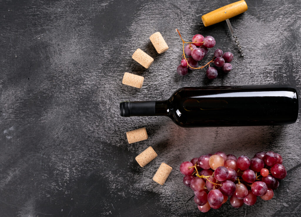 top-view-red-wine-with-grape-copy-space-left-black-stone-horizontal-1024x740.jpg